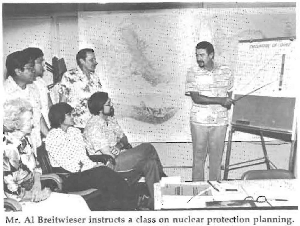 Mr. AI Breitwieser instructs a class on nuclear protection planning.