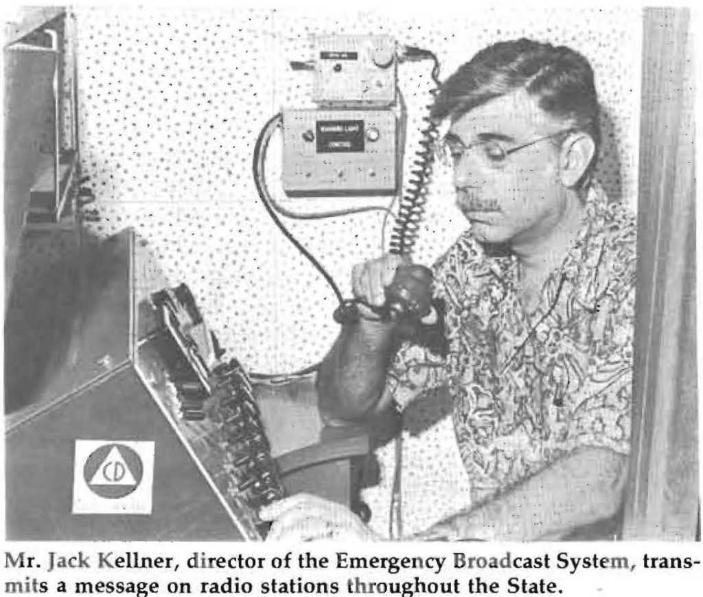 Mr. Jack Kellner, director of the Emergency Broadcast System, transmits a message on radio stations throughout the State.
