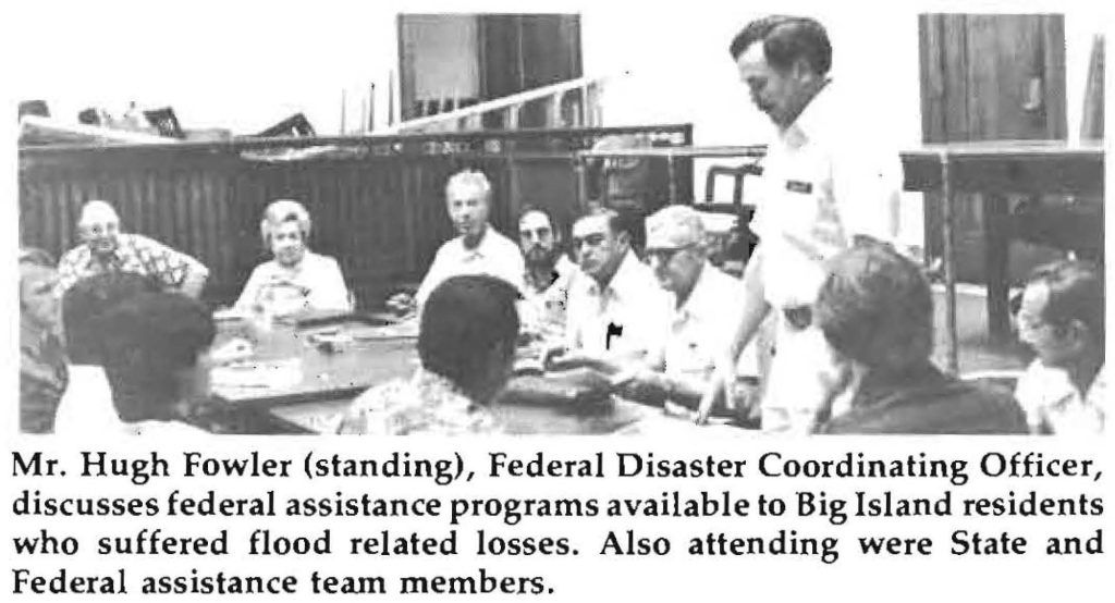 Mr. Hugh Fowler (standing), Federal Disaster Coordinating Officer, discusses federal assistance programs available to Big Island residents who suffered flood related losses. Also attending were State and Federal assistance team members.