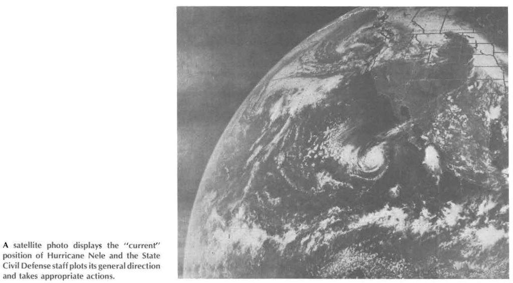 A satellite photo displays the " current" position of Hurricane Nele and the State Civil Defense staff plots its general direction and takes appropriate actions.