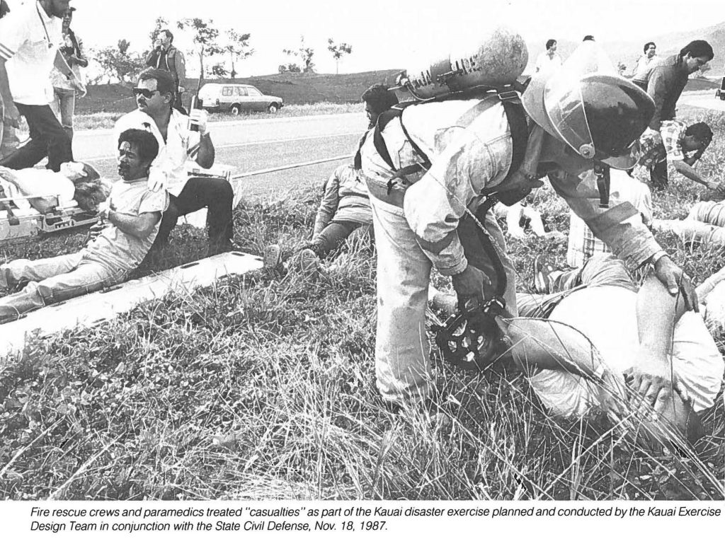 Fire rescue crews and paramedics treated "casualties" as part of the Kauai disaster exercise planned and conducted by the Kauai Exercise Design Team in conjunction with the State Civil Defense, Nov. 18, 1987.