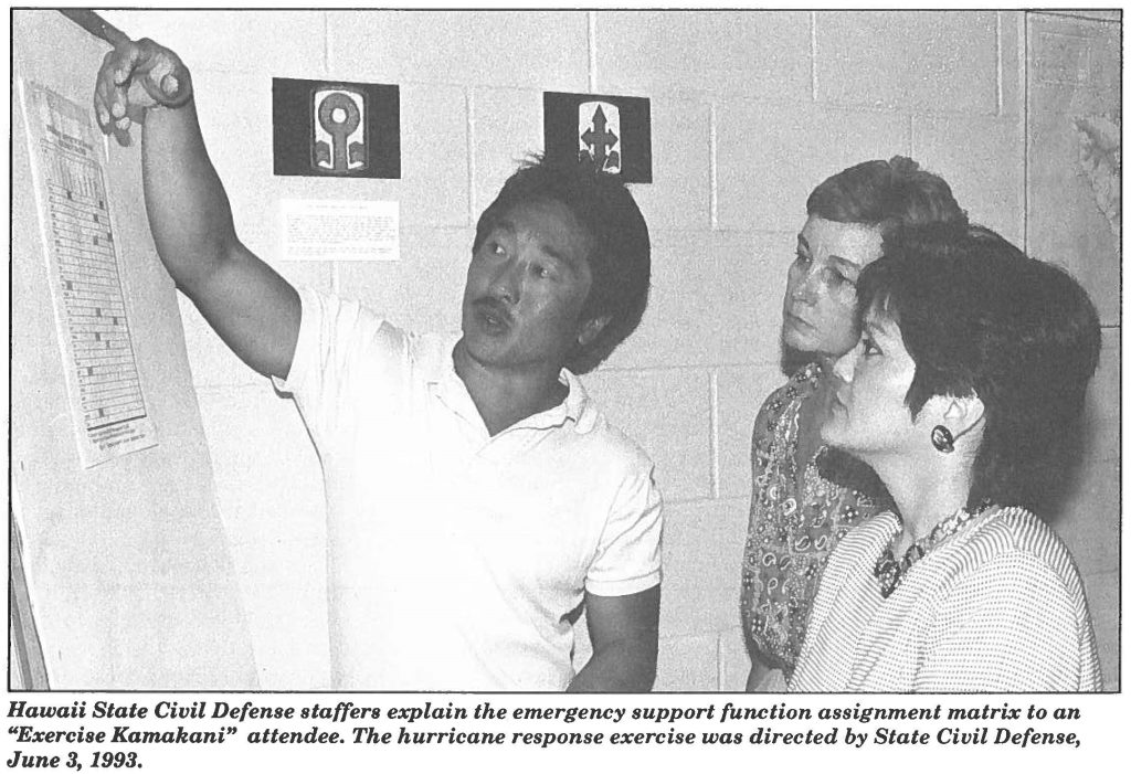 Hawaii State Civil Defense staffers explain the emergency support function assignment matrix to an "Exercise Kamakani" attendee. The hurricane response exercise was directed by State Civil Defense, June 3, 1993.