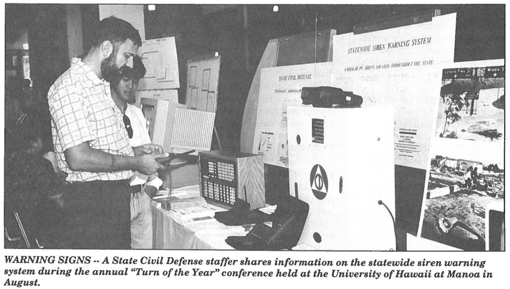 WARNING SIGNS -- A State Civil Defense staffer shares information on the statewide siren warning system during the annual "Turn of the Year" conference held at the University of Hawaii at Manoa in August.