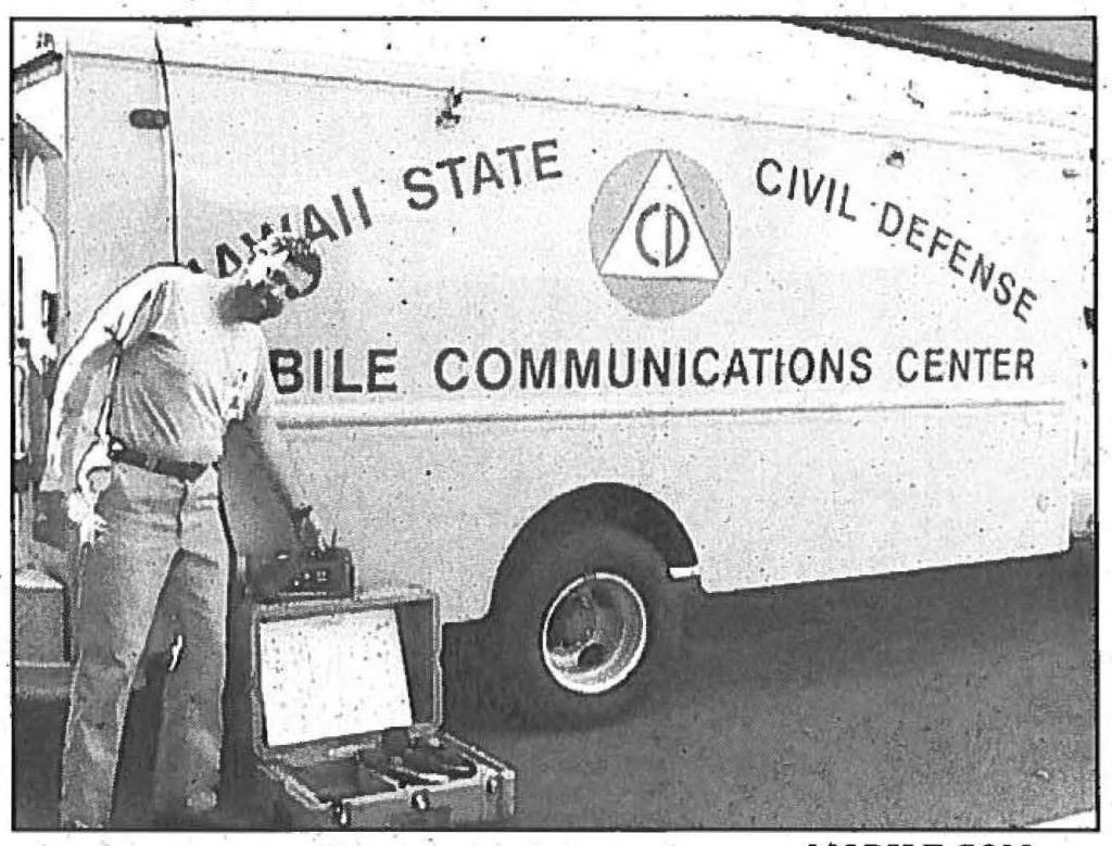 MOBILE COM - Thomas C. Simon, a radio technician with State Civil Defense, shows the mobile satellite phone system from their mobile communications van. Max· W. Starr photo