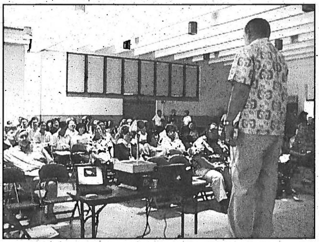 WHAT'S THE PLAN? - Roy C. Price Sr.; state Civil Defense vice director; briefs the Exercise MAKANI PAHILI 99 participants at the mock disaster Assistance Center, HIARNG, Waiawa facility in May. Max W, Starr photo
