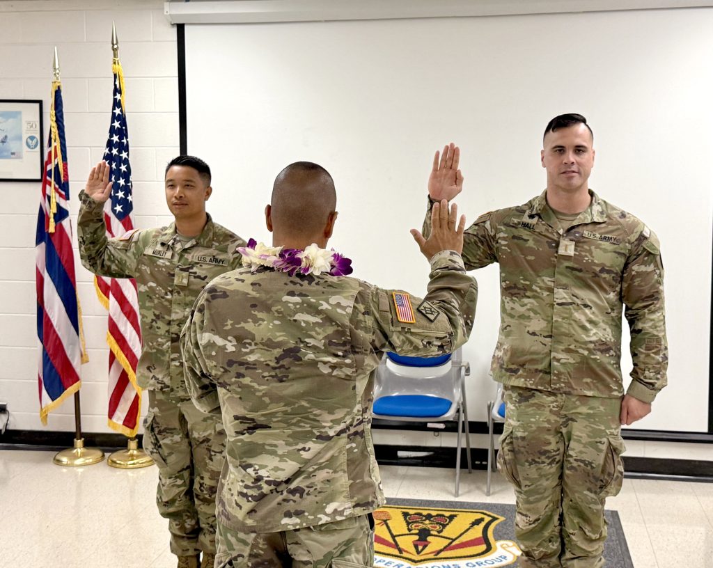 Second Lieutenants Sean Murley and Abraham Hall were administered the oath of office by Chaplain Christopher Guadiz; (Hawai‘i National Guard photos by Staff Sgt. Julius Maeva, Capt. Lindsay Kraus and Col. Christopher Guadiz)
