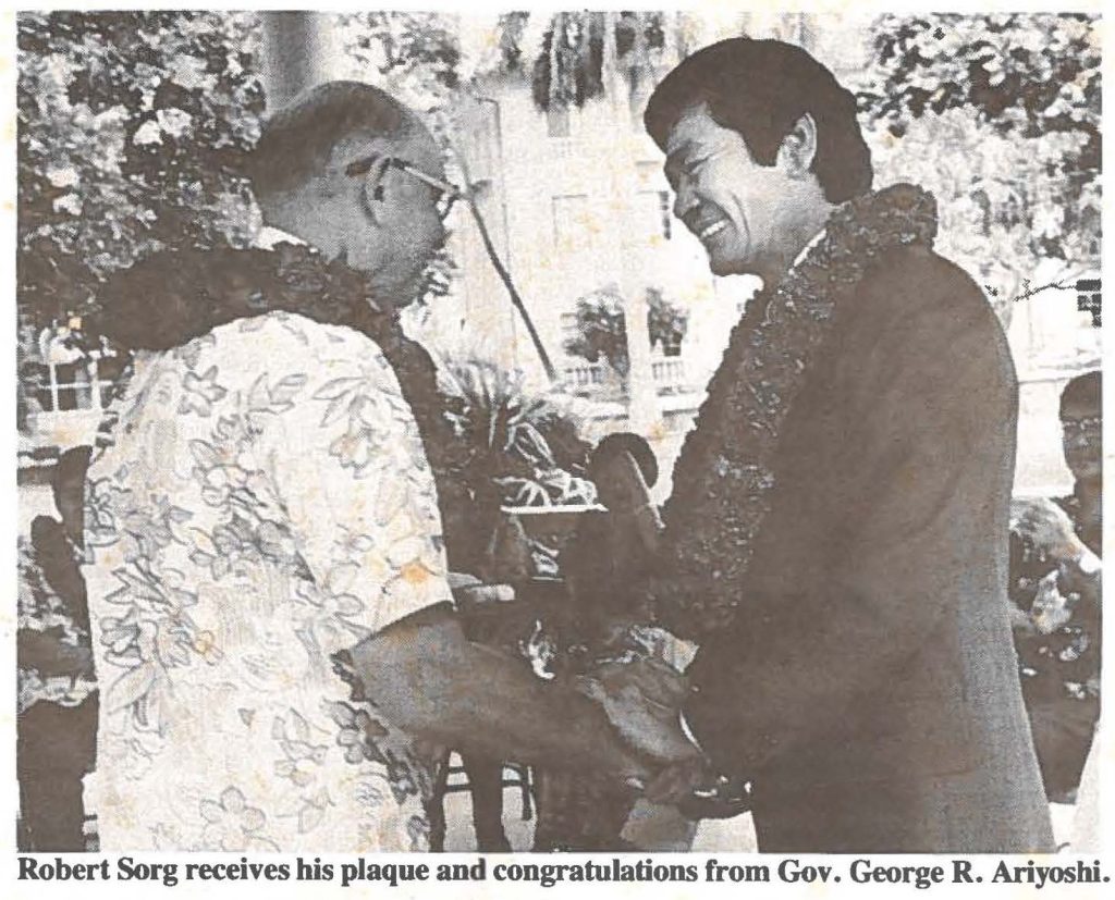 Robert Sorg receives his plaque and congratulations from Gov. George R. Ariyoshi.