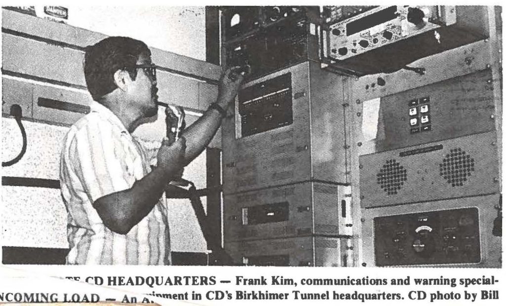 CD HEADQUARTERS - Frank Kim, communications and warning specialist . . . equipment in CD's Birkhimer Tunnel headquarters. CD photo by Bill