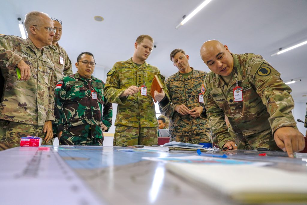 Joint and multilateral military personnel converse at a Joint Staff Exercise during Super Garuda Shield 25 in Jakarta, Indonesia on Aug. 29, 2025. (U.S. Army National Guard photo by Sgt. Sean Walker)