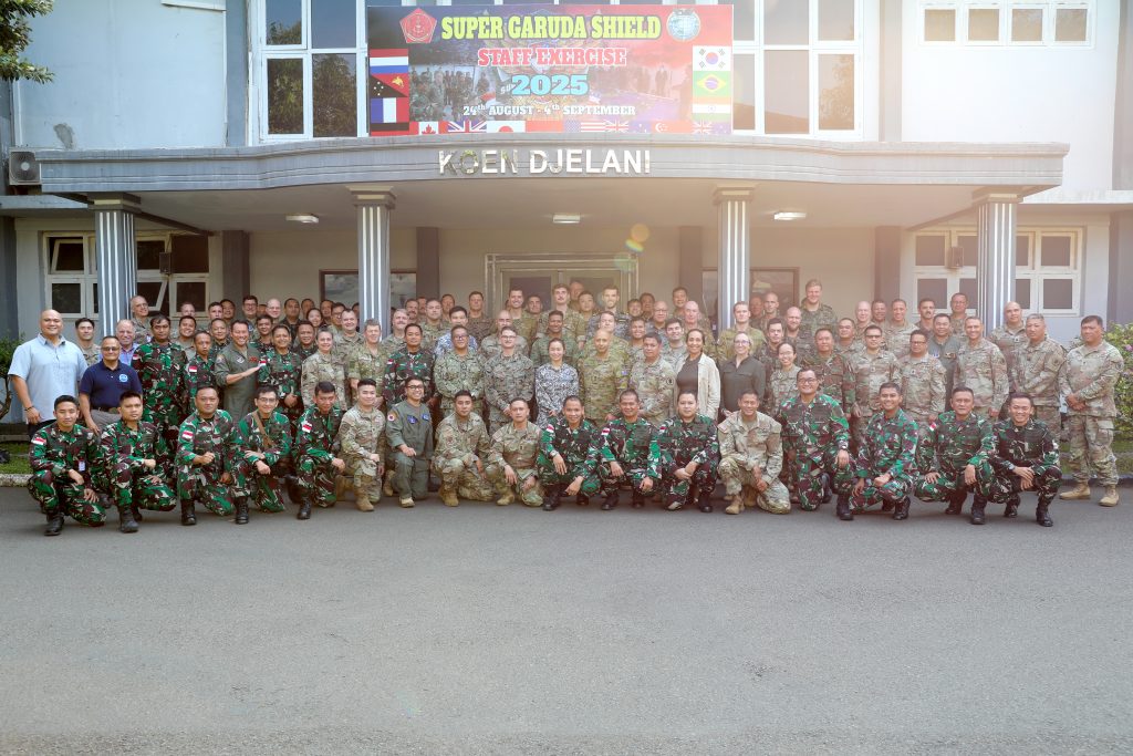 Joint and multilateral personnel pose for a group photo at a Staff Exercise during Super Garuda Shield 25 in Jakarta, Indonesia, Sept. 1, 2025. Super Garuda Shield is an annual exercise between the Indonesian National Armed Forces and U.S. Military designed to strengthen bilateral interoperability, capabilities, and cooperation. (U.S. Army National Guard photo by Sgt. Sean Walker)