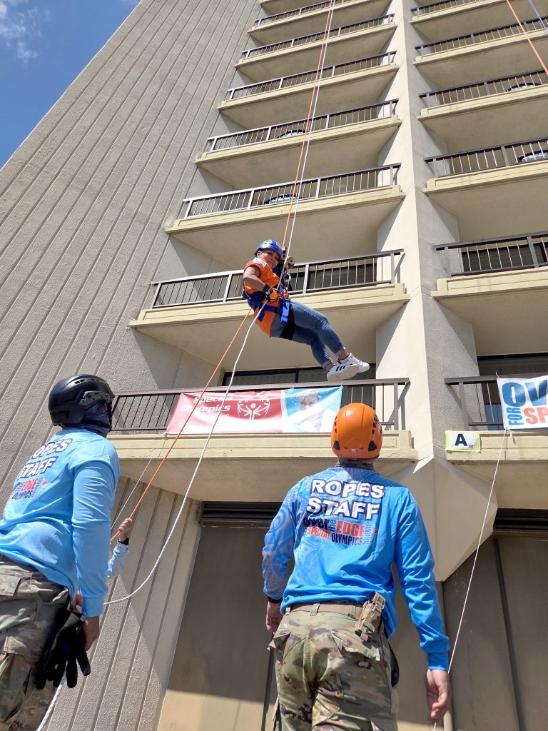 Sgt. Kilauea Lau, Sgt. 1st Class Ross Nakatsu and Sgt. Paul Gallardo helped participants return safely to solid ground after rappelling 40 stories from the top of the hotel tower, top left. They supervised the descent, ensuring the ropes remained steady and untangled.