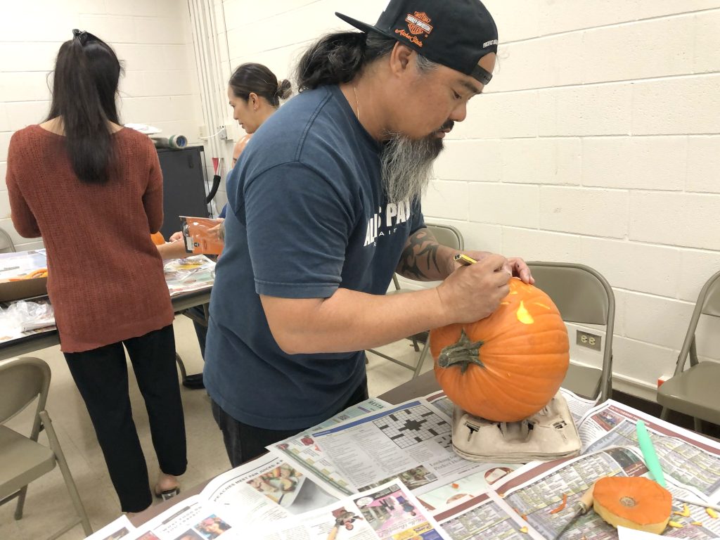Halloween pumpkin carving, food sale supports Aloha United Way
