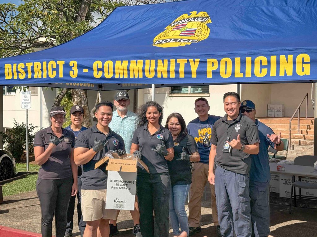 Sgt. Arnold Escano,left, and Sgt. Navi Chambers stood alongside local law enforcement partners at the Pearl City Police Station collection site. (Hawai‘i National Guard Counterdrug Program photos)