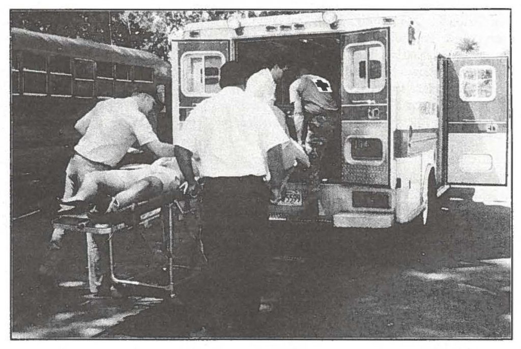 County, State, and Federal Emergency Response Teams participate in amass casualty exercise at Kapiolani Park as part of the State Department of Defense exercise, May 3-9. Make-up was used
to simulate injuries. The active duty "actors" added to the scenario by making the training exercise more life-like. 