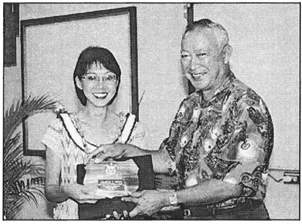 ADJUTANT GENERAL'S AWARD WINNER - Clarice Chung is presented the Department of Defense employee of the year award by Maj. Gen. Edward V. Richardson, the adjutant general. Sgt. 1st Class Stephen M. Lum photo