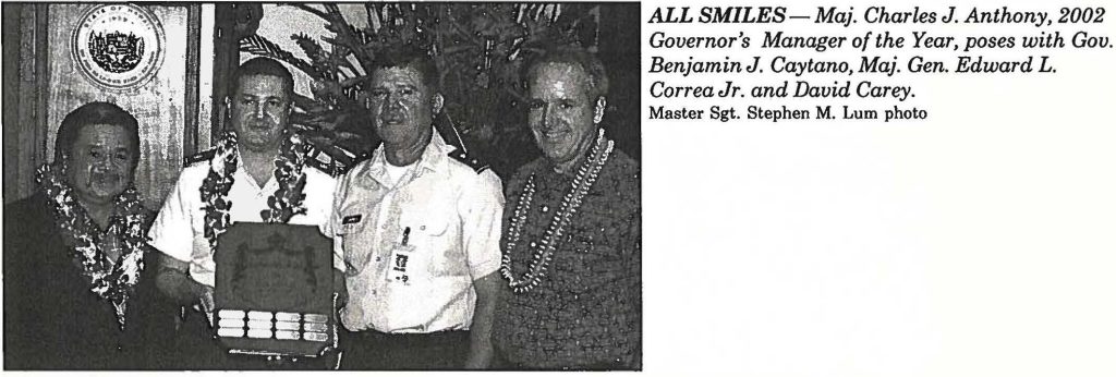 ALL SMILES- Maj. Charles J. Anthony, 2002 Governor's Manager of the Year, poses with Gov. Benjamin J. Caytano, Maj. Gen. Edward L. Correa Jr. and David Carey. Master Sgt. Stephen M. Lum photo