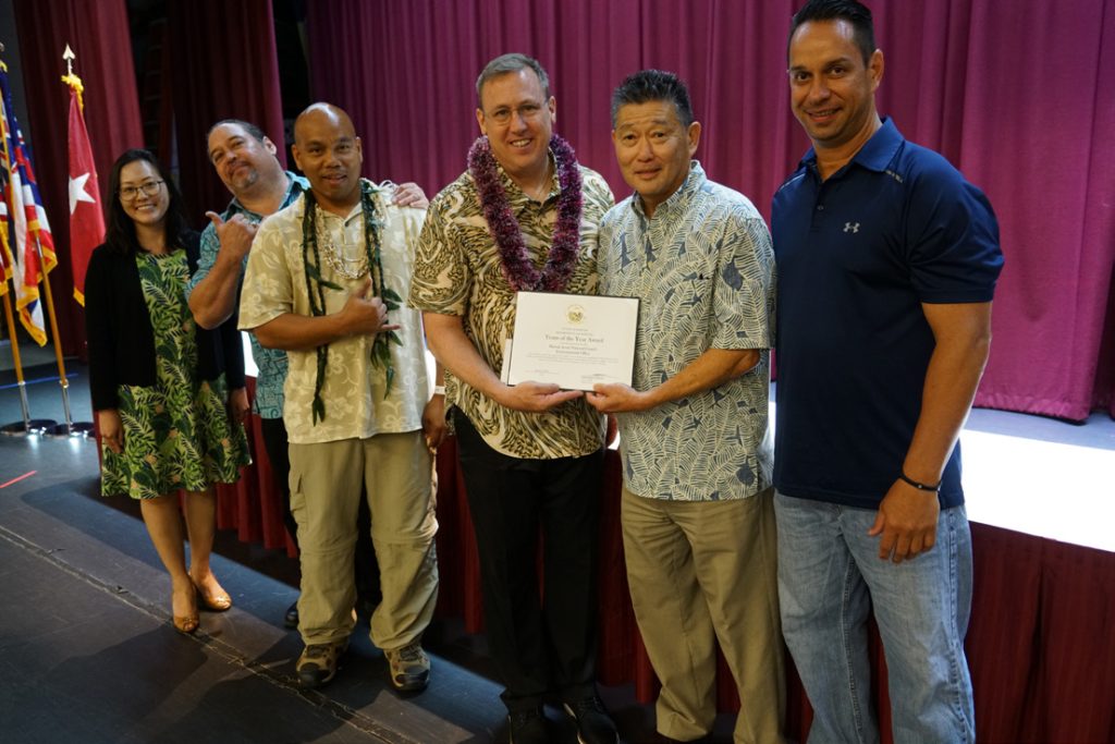 Team of the Year Award 3 - Environmental Office The members of this team are Ryan Auyong, Kristine Barker, Kevin Boehning, Craig Blaisdell, Wendy Broxson; Ian Cevallos; Leslie Chau; Pamela Divine; Wendell Hatami; Charles Huihui; Alexa Jacroux-Biggs; Arthur Javier; Yam Yi Lee; Karl Motoyama; Lynne Nakamoto; Clint Soares; Mario Tabaquin.
