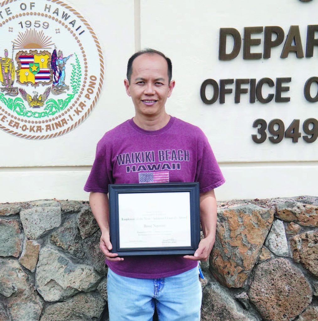 Bang Nguyen, Janitor II, Engineering Office, with his Adjutant General’s Award certificate. – Ruben Duldulao photo