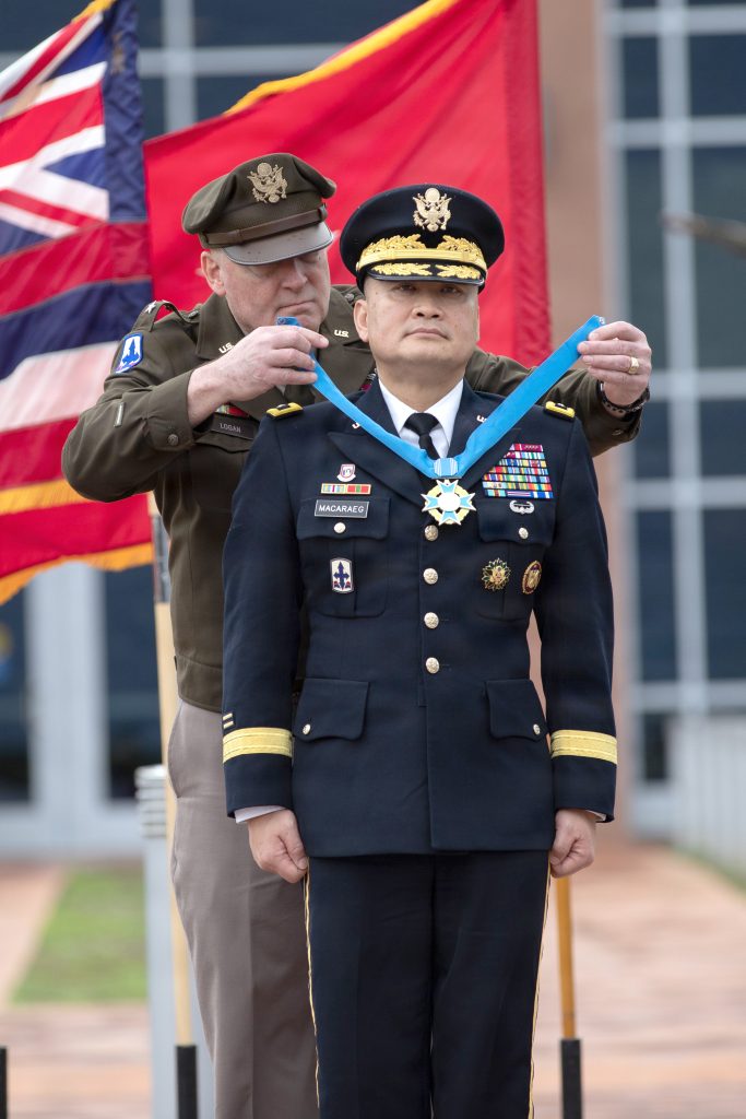 Maj. Gen. Roy Macaraeg, the Senior Military Advisor for the Deputy Assistant Secretary of the Army, Military Personnel and Quality of Life, Assistant Secretary of the Army, Manpower & Reserve Affairs (ASA M&RA), received the State of Hawaii Distinguished Service Order from Hawai‘i Adjutant General Maj. Gen. Stephen F. Logan during his retirement ceremony at the 29th Infantry Brigade Combat Team Readiness Center in Kalaeloa on Dec. 19, 2025. Macaraeg continued his career at the National Guard Bureau as an Operations Research Analyst and went on to hold various positions serving the Army National Guard. (U.S. Army National Guard photo by Sgt. Mariah-Alexsandra Manandic-Kapu)