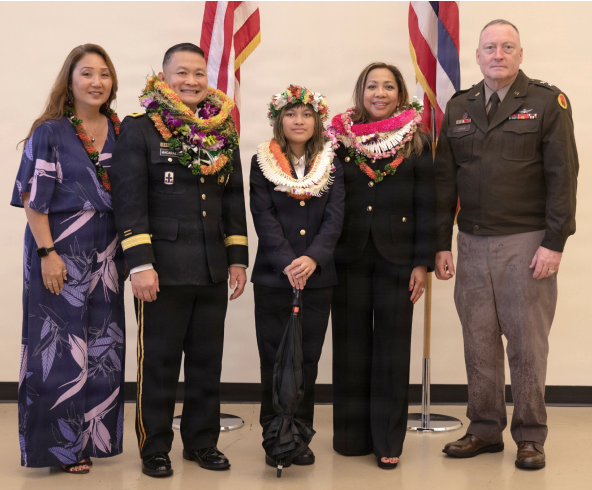 Hawai‘i Adjutant General Maj. Gen. Stephen Logan and Maj. Gen. Roy Macaraeg posed for a photo with loved ones after Macaraeg’s retirement ceremony at the 29th Infantry Brigade Combat Team Readiness Center in Kalaeloa on Dec. 19, 2025. (Photo by U.S. Army National Guard photos by Sgt. Mariah-Alexsandra Manandic-Kapu)