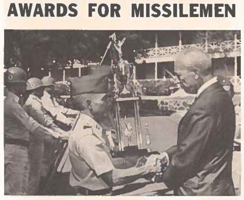 Governor Burns awards Governor's Trophy to Capt Rudolph Thomas CO of Battery "C" 1st Missile Bn., 298th Arty for achieving highest firing score during lad Annual Service Practice. Moments later, unit was also awarded the USARHAW trophy by Maj Gen Corl Darnell, Jr., Commanding General United States Army Hawaii.