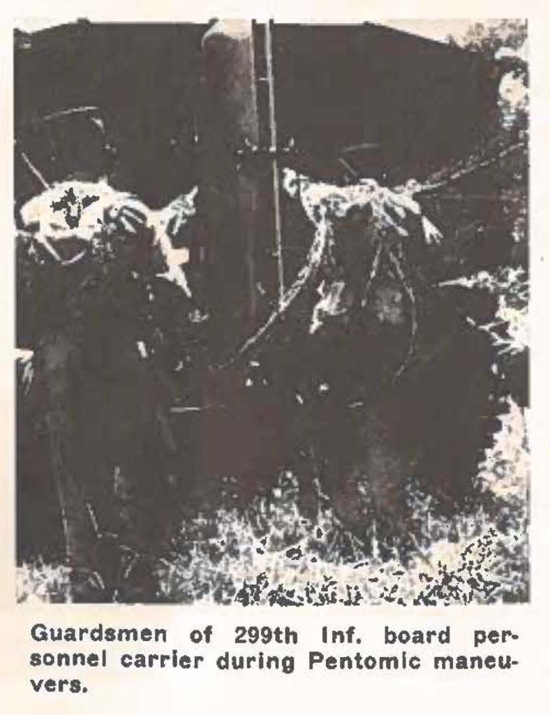 Guardsmen of 299th Inf, board personnel carrier during Pentomic maneuvers,