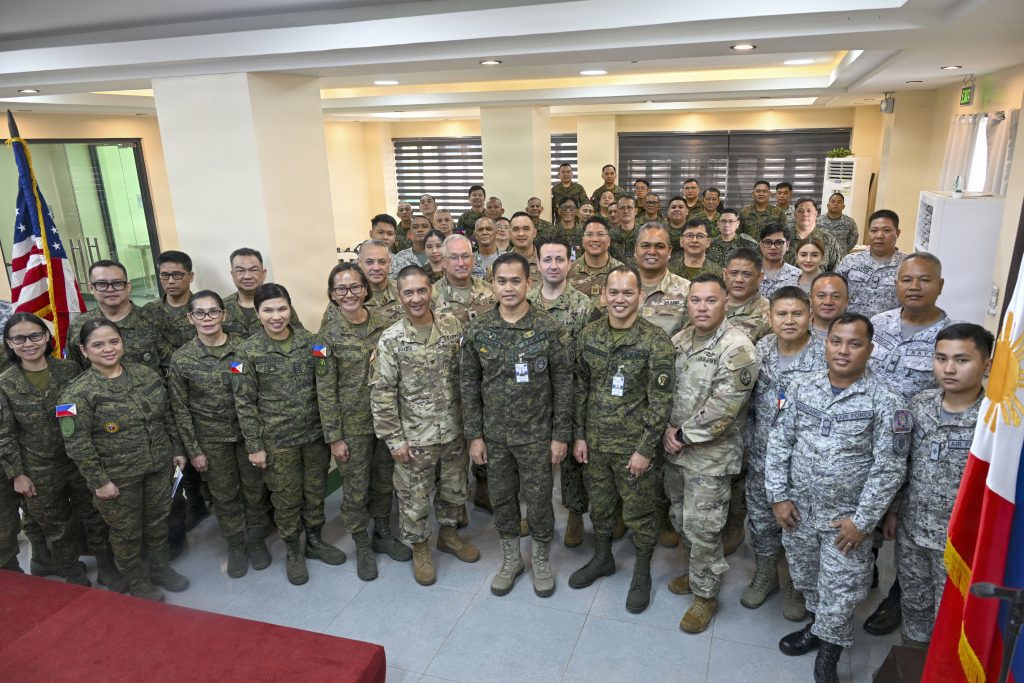 Chaplains and Judge Advocate Generals from the U.S. and Philippine Armed Forces take a group photo during a Subject Matter Expert Exchange, Feb. 18, 2026, Camp General Emilio Aguinaldo, Quezon City, Philippines. The exchange was part of the U.S. National Guard's State Partnership Program which links a State's National Guard with foreign partner nations to build long-term, mutually beneficial security relationships. (U.S. Air National Guard photo by Tech. Sgt. Orlando Corpuz)
