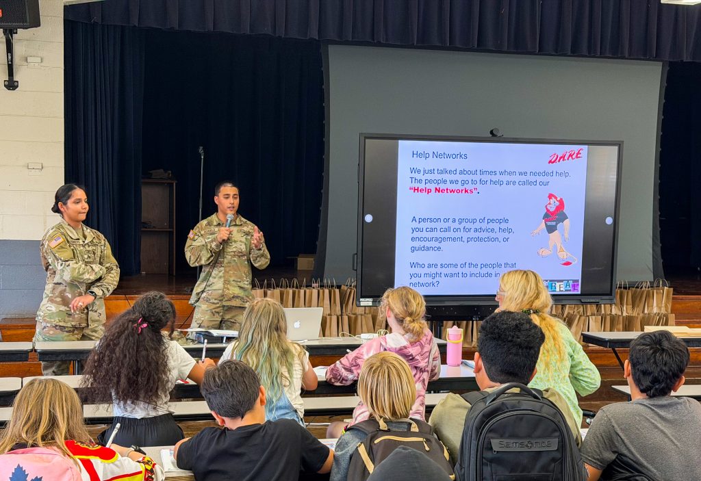Sgt. Navpreet Chambers and Sgt. Samson Achuela taught Iroquois Point Elementary School students how to be an upstanding citizen.