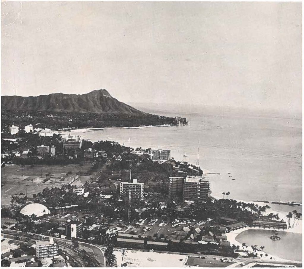 Waikiki-Aerial photo shows Waikiki hotels, with Diamond Head In the background. In the foreground Is the Hawaiian Village hotel, official headquarters for the 82nd General Conference of the National Guard Association of the United States. In the left foreground Is the Kalger Dome