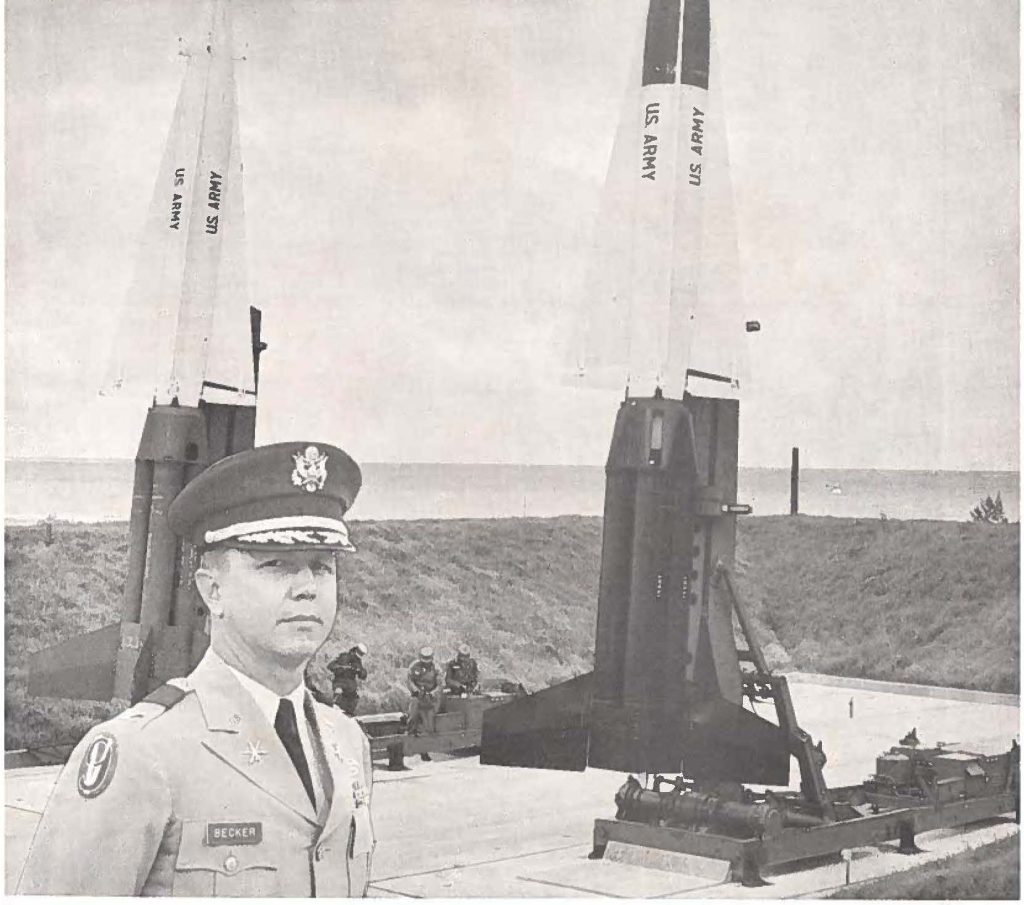 The "Mein Behind the Missiles" is CoI. John Becker, commander of the 298th Artillery Group (Air Defense). The missiles pictured belong to Battery "C" located at Bellows Air Force Station, Waimanalo. (Picture by the Editor)