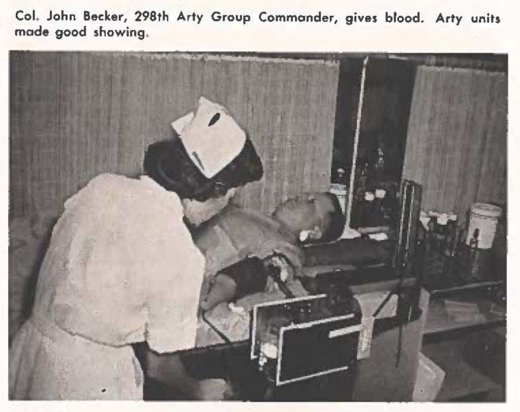 Col, John Becker, 298th Arty Group Commander, gives blood. Arty units made good showing.