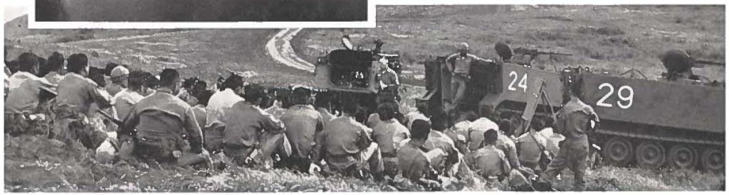 Members of 2nd Battle Group receiving instruction in the field.