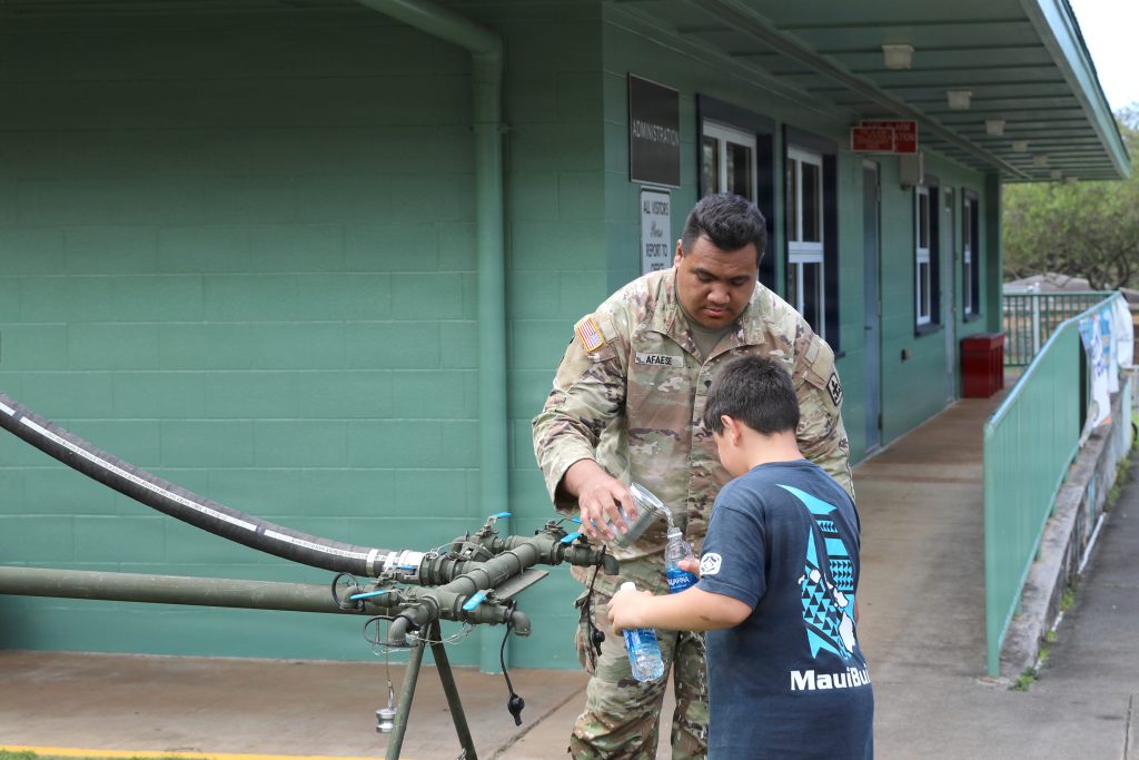 Spc. Alaricson Afaese helped distribute potable water in Waialua on March 25. (U.S. Army National Guard photos by Spc. Daniel Barcenas)