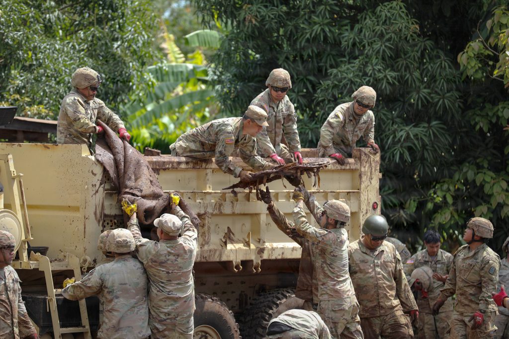 Hawai‘i National Guard (HING) soldiers and airmen helped with debris removal on April 1 in Waialua. (U.S. Army National Guard photo by Spc. Daniel Barcenas)