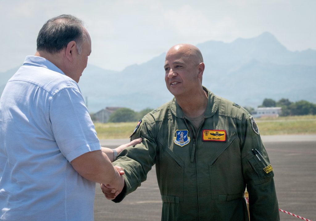 Philippine Secretary of National Defense Gilberto C. Teodoro Jr., left, greeted Hawai‘i Air National Guard commander Brig. Gen. Phillip L. Mallory during operations. (U.S. Air National Guard photos by Senior Master Sgt. Mysti Bicoy)