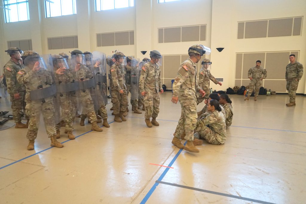 Soldiers with the Hawai’i National Guard conduct civil disturbance training at the 29th Readiness Center, Kalaeloa, Hawaiʻi, in March. The training, where soldiers acted as both protesters and responders, is part of an effort to meet updated federal guidelines for the National Guard Response Force, which focuses on de-escalation, site security and the protection of critical infrastructure. (U.S. Army National Guard photos by Rachel Blaire and retired Master Sgt. Andrew Jackson)