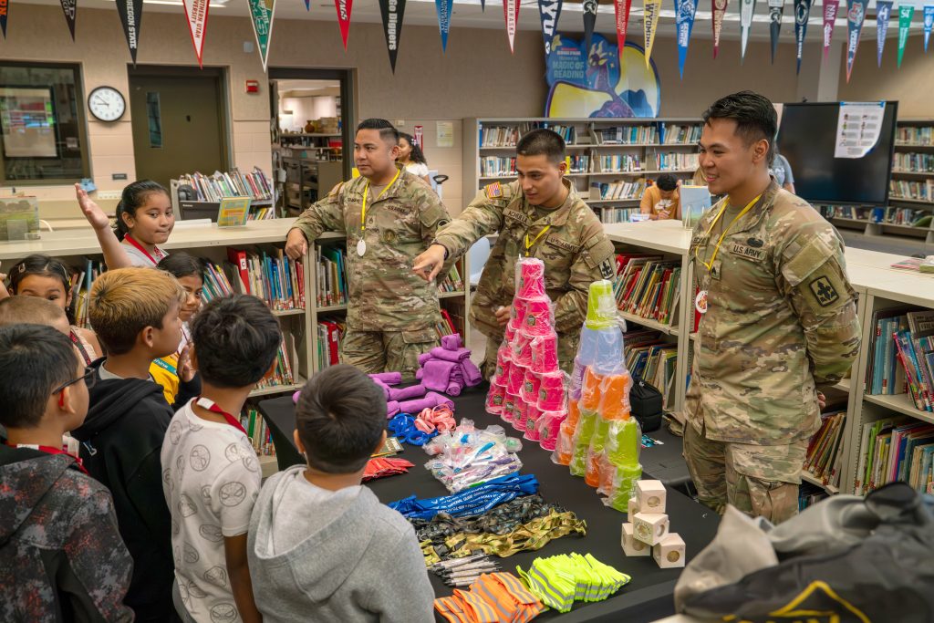 Staff Sgt. Norvin Gulmayo, Recruiting and Retention, left, joined Sgt. Samson Achuela and Sgt. Arnold Escanom, HING-CDP, at Iroquois Point Elementary School during “Purple-Up Day” on April 13, 2026. (Hawai‘i National Guard Counterdrug Program photos)
