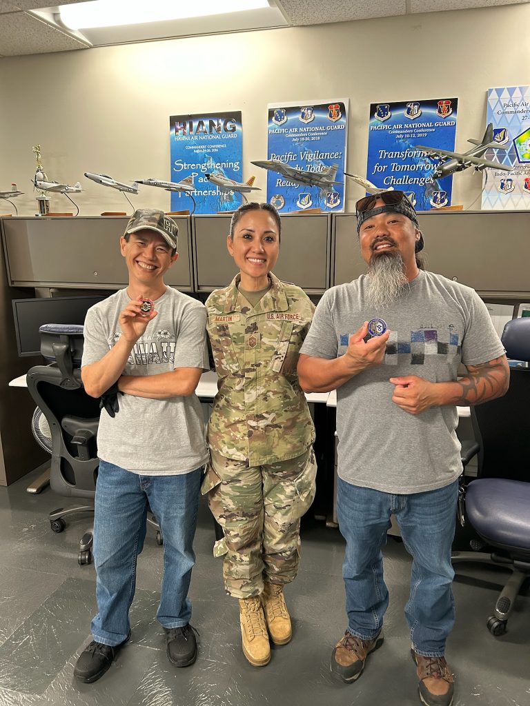 Hawai‘i Air National Guard State Command Chief Mey Martin presented her Command Chief coin to Bang Nguyen, left, and Tommy Ah Sam. U.S. Air National Guard photos by retired Master Sgt. Darrell Bactad