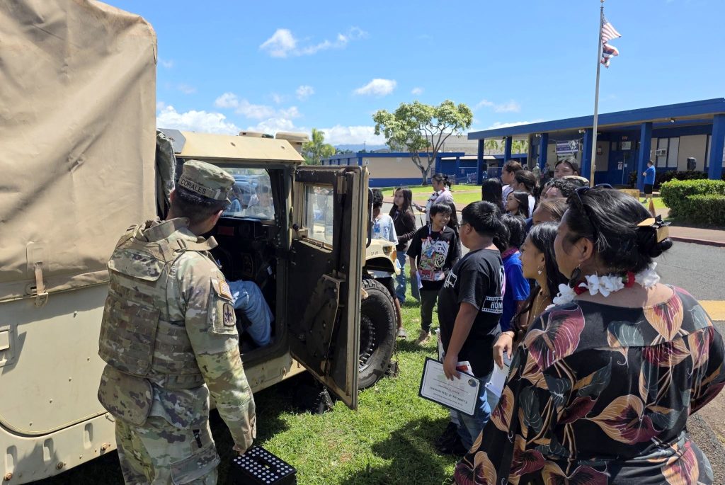 Staff Sgt. Brandon Corales of the Hawai‘i National Guard Counterdrug Support Program (HING-CDP) gave students a look at a humvee during the Honowai Elementary School D.A.R.E. graduation on April 1, 2026. (Hawai‘i National Guard Counterdrug Program photos)