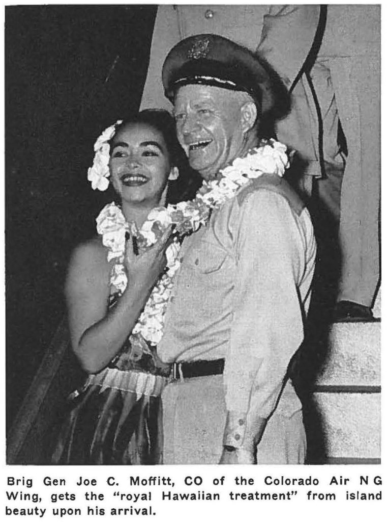 Brig Gen Joe C. Moffitt, CO of the Colorado Air NG Wing, gets the "royal Hawaiian treatment" from island beauty upon his arrival.