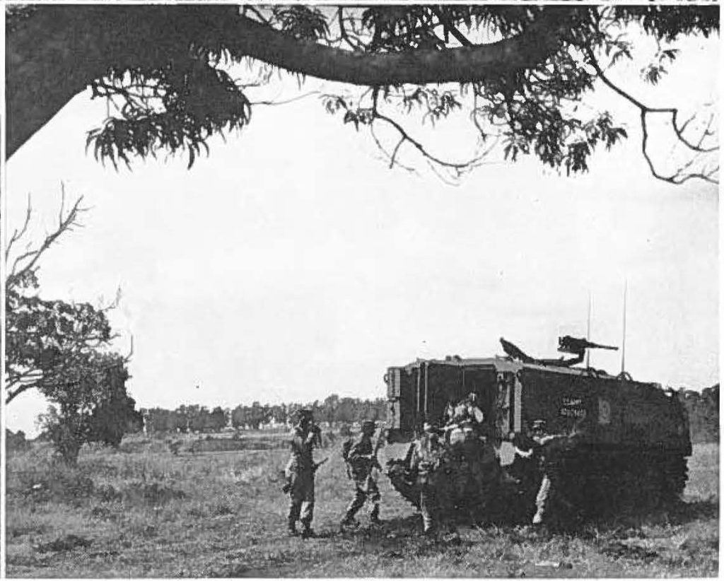 Men of 299th RCT enter personnel carrier