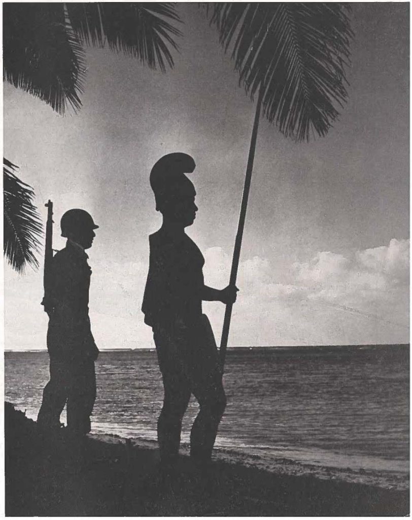 This cover photo, taken in early evening by Mr. Herbert Smith of Portraits Hawaii, tells the story of our heritage. Soldier is 2nd Lt Ralph Faufata and the warrior Is 1st Lt Ed Hara, both of the 120th Mllitary Police company.