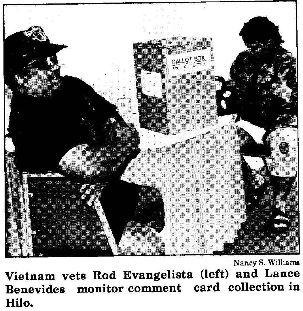 Vietnam vets Rod Evangelista (left) and Lance Benevides monitor comment card collection in Hilo.