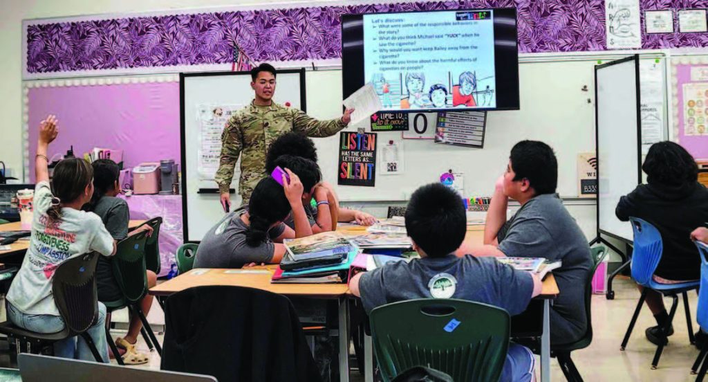 Sgt. Arnold Escano of the Hawai‘i National Guard Counterdrug Program led a fifth-grade D.A.R.E. class at Palolo Elementary School, empowering students to make healthy choices and resist peer pressure. – Hawai‘i National Guard photo