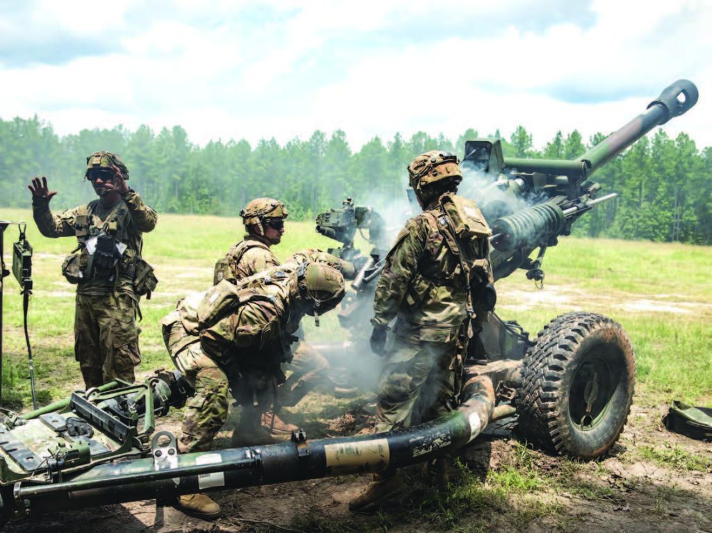 Soldiers from the 1st Battalion, 487th Field Artillery Regiment worked with the Oregon Army National Guard’s 2nd Battalion, 218th Field Artillery Regiment to clear the chamber of a M119A3 howitzer during live fire exercises at the Joint Readiness Training Center (JRTC) during JRTC rotation 24-09 at Fort Johnson, La. in July 2024. – Oregon Army National Guard photo