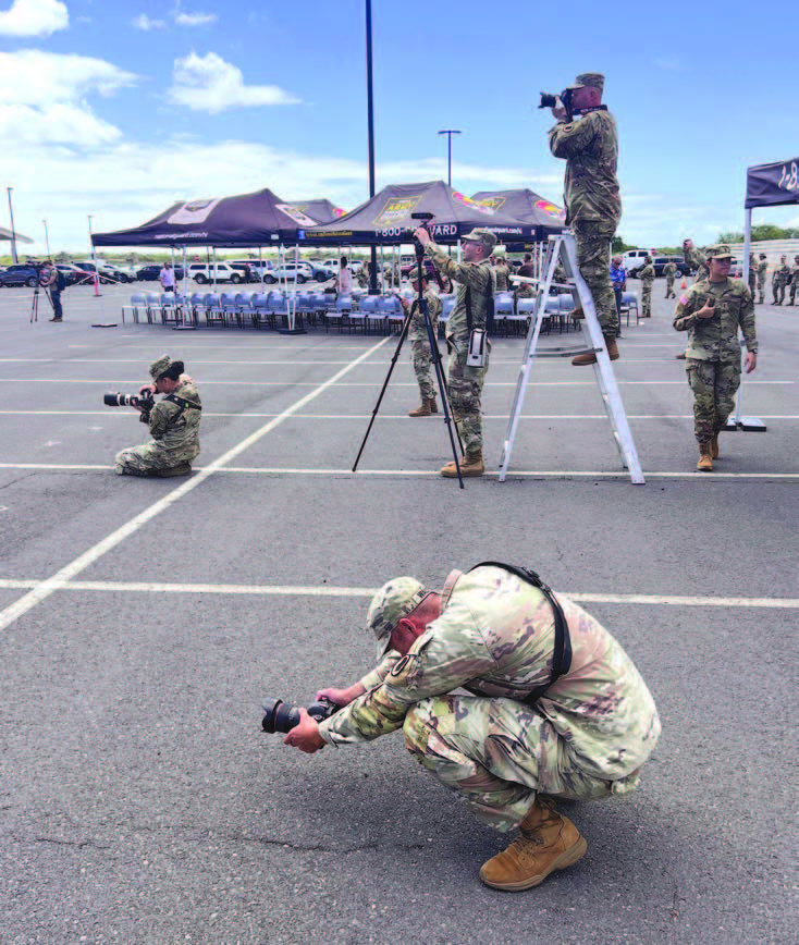 Soldiers from the 117th Mobile Public Affairs Detachment captured photos and videos at a ceremony. – Hawai‘i National Guard photo by Staff Sgt. John Schoebel