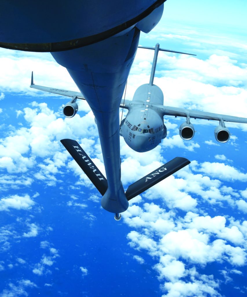 A C-17 Globemaster III, assigned to the 204th Airlift Squadron, approached a KC-135 Stratotanker, assigned to the 203rd Air Refuelling Squadron in October 2024, near Hawai‘i. The sortie was part of the Joint Pacific Multinational Readiness Center, an exercise designed to enhance readiness in environments and conditions where U.S. and allied forces are likely to operate. – Hawai‘i National Guard photo by Tech. Sgt. John Linzmeier