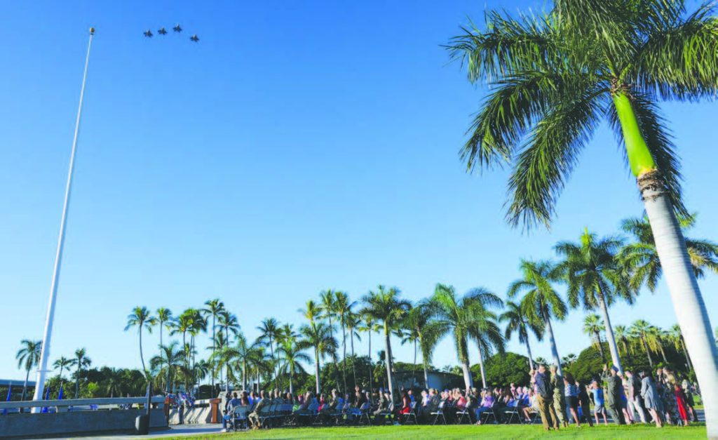 F-22 Raptors performed a flyover during the 83rd Remembrance Ceremony for the attack on Hickam Field at Joint Base Pearl Harbor-Hickam on Dec. 7, 2024. Attendees gathered at Atterbury Memorial Park to honor the service members killed and the wounded in the 1941 Japanese air raids at Hickam Field, reflecting on their sacrifices and the impact on others. – U.S. Air Force photo by Staff Sgt. Alan Ricker