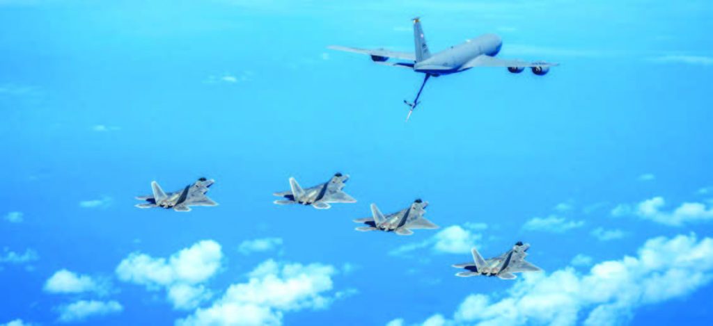 F-22 Raptors from the Hawai‘i Air National Guard’s 154th Wing received fuel from the 203rd Air Refueling Squadron’s KC-135 Stratotanker while training over the Pacific Ocean in September 2024. During the mission, Brig. Gen. Phillip Mallory, 154th Wing commander, achieved a significant milestone of 1,000 flight hours in the F-22. – Hawai‘i National Guard photo by Master Sgt. Mysti Bicoy