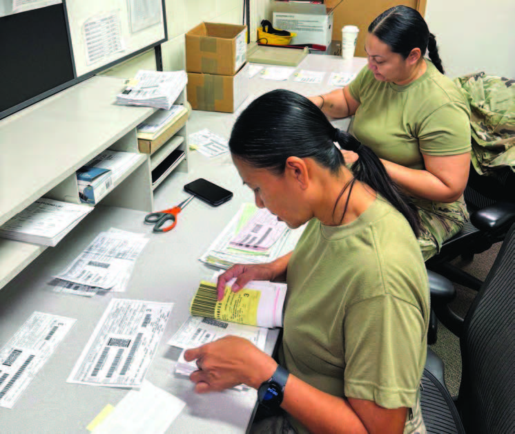 Sgt. Janique Malenky, left, and Sgt. Rosana Siquig reconciled receipts and shipments for the U.S. Property and Fiscal Office during annual training.